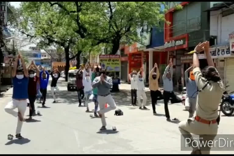 Police is teaching yoga to people walking on the street