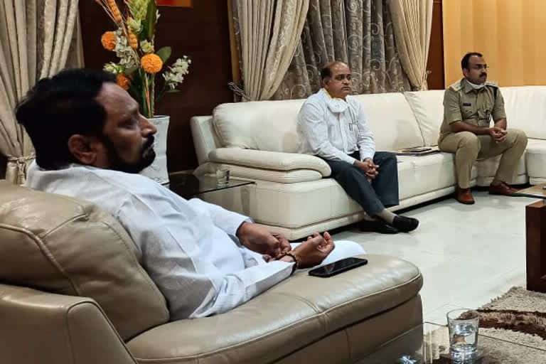 DCM Laxman Sawadi meeting with officials