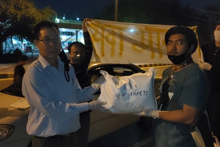 RSS workers distribute ration to north east students