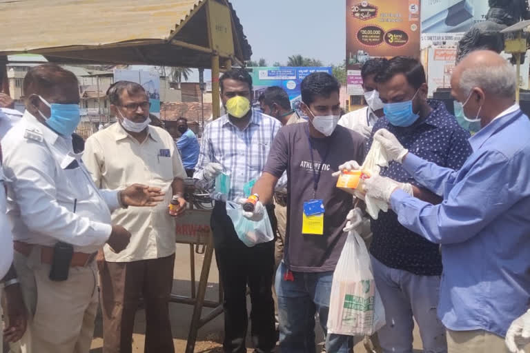 Distribution of hand gloves, sanitizer by health service company to Corona management staff