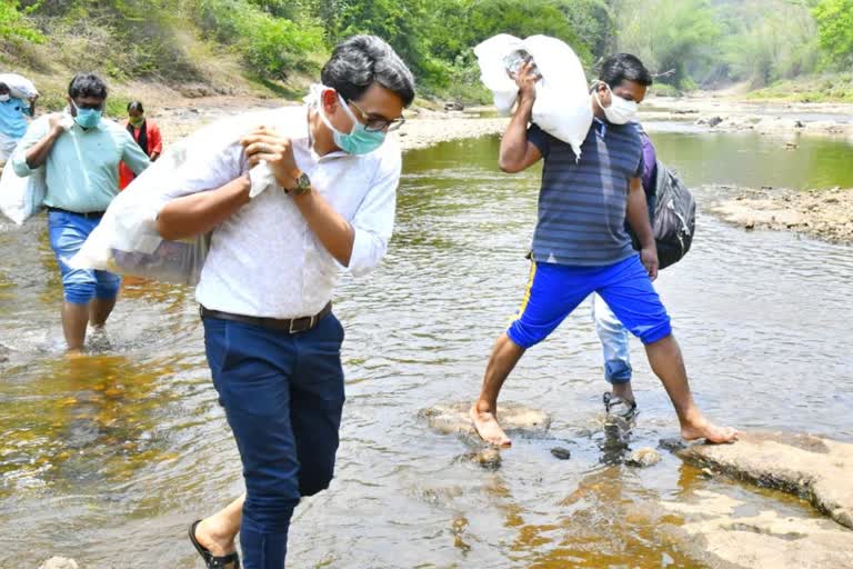 District Collector and MLA trekked kilometres to carry rice and groceries to a tribal settlement