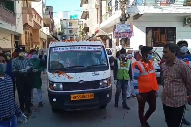 People shower flowers on sanitation workers in Gurugram amid coronavirus outbreak