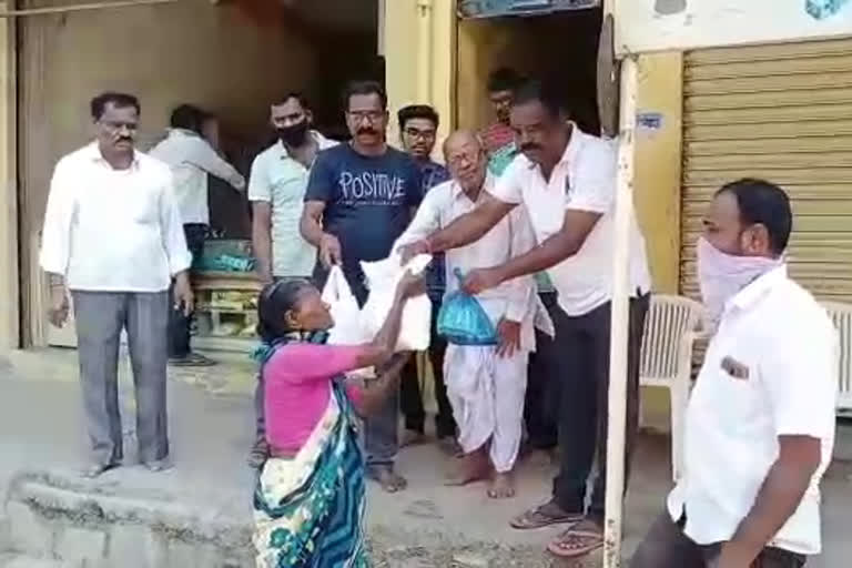 free essential distribution by a man to the poor in sangareddy