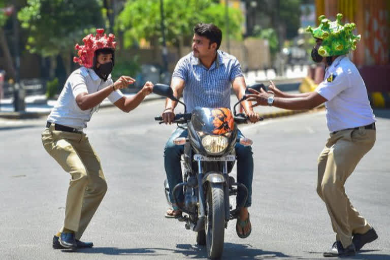 Kalaburgi police force yoga session on lockdown violators, gift candles