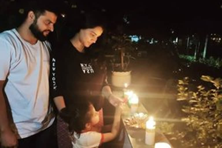 Sports players light candles in response to PM Modi's appeal