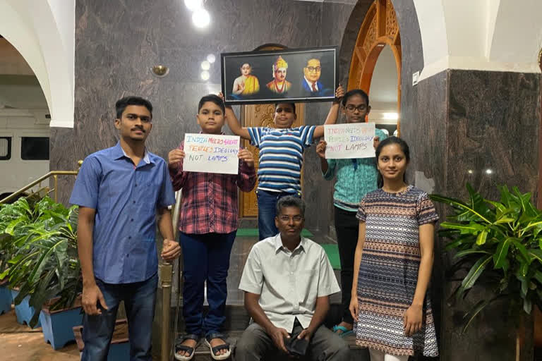 KPCC president exhibiting Buddha, Basava, Ambedkar photo