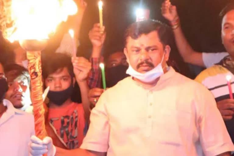 telangana-bjp-mla-holds-fire-torch-protest-slogan-chinese-virus-go-back