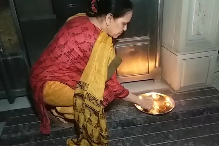 people light diyas outside  their home on modi appeal on 5 april in delhi