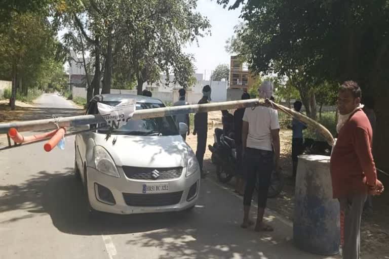 villagers guarding outside kheda village of faridabad