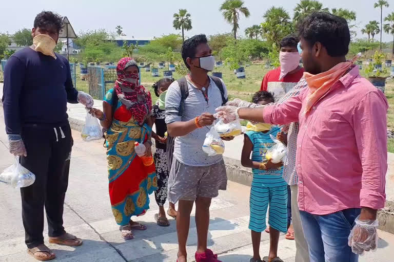 food packets distributed to the poor by reddy bavi village youth in pantangi toll plaza at yadadri bhuvanagiri