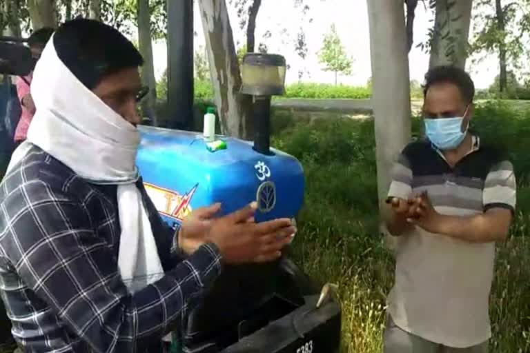 panipat farmers using sanitizer and mask before crops harvesting