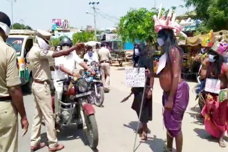 With the peculiar attire the corona tightening campaign at husnabad