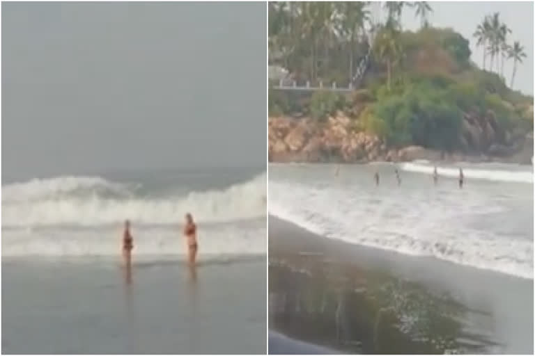 കോവളത്ത് ലോക്‌ഡൗൺ ലംഘിച്ച വിനോദ സഞ്ചാരികൾ കടലില്‍