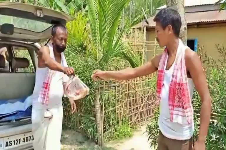 nurjamal sarkar distributed fish among villagers