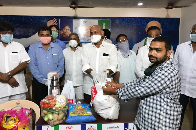 anaparthi mla giving essentials to journalists