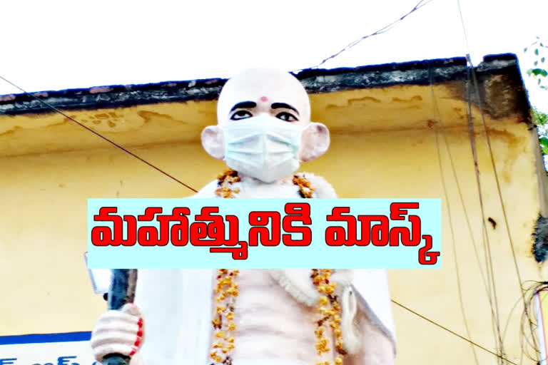 masked the statue of Gandhi at station ghanpur