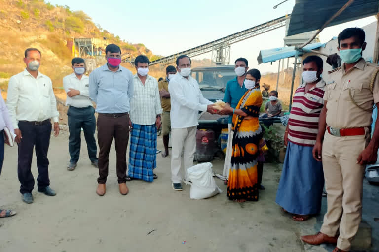 Mla  distributes food kit to crusher plant workers