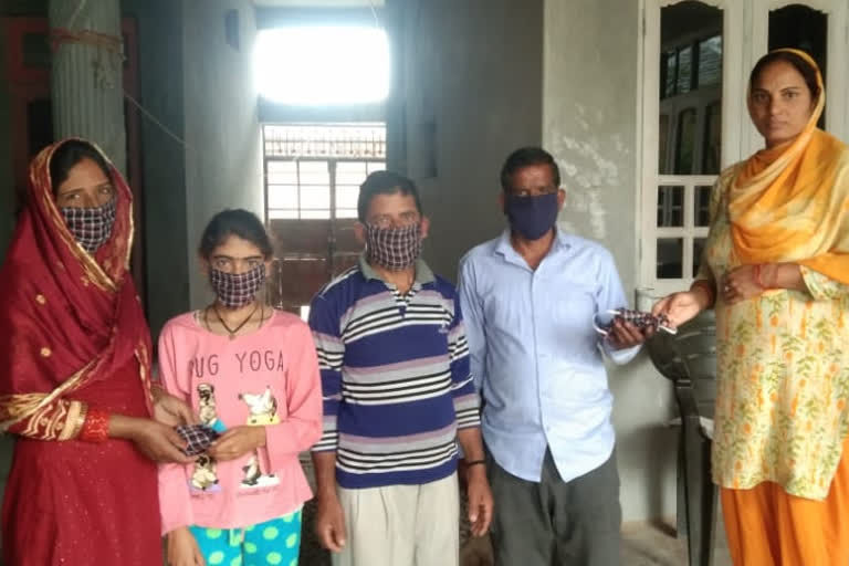 distributing free masks in villages