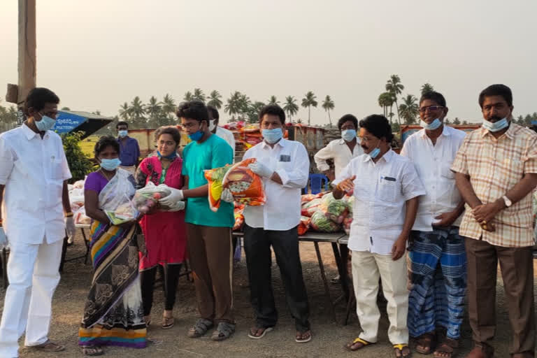 children distributed essential goods to poor people at arthamuri in eastgodavari