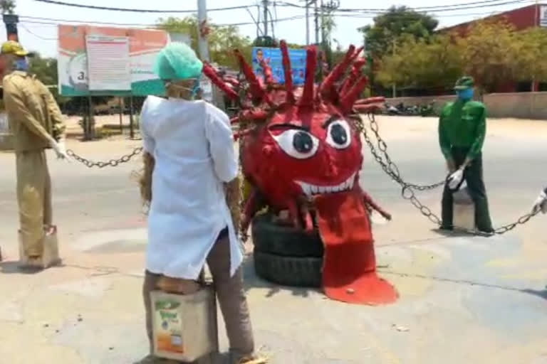 awareness against coronavirus in Raichur: Giant corona image on the road