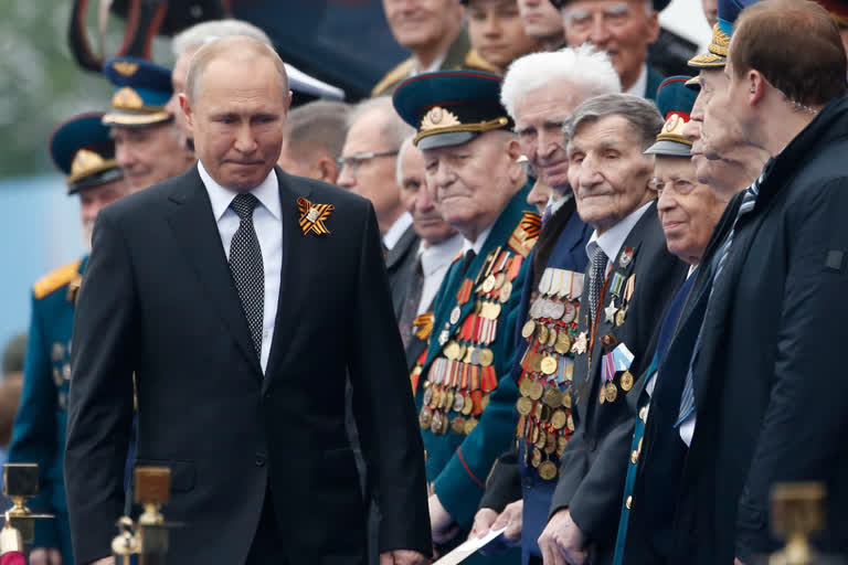 In this file photo taken on Thursday, May 9, 2019, Russian President Vladimir Putin walks attending a military parade marking 74 years since the victory in WWII in Red Square in Moscow, Russia.