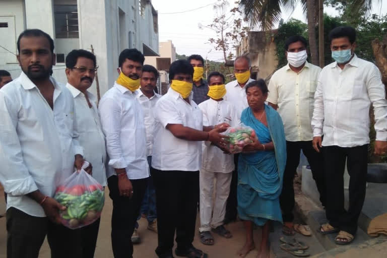 tdp leader kuna ravikumar distribute daily needs to lolugu villagers srikakulam district