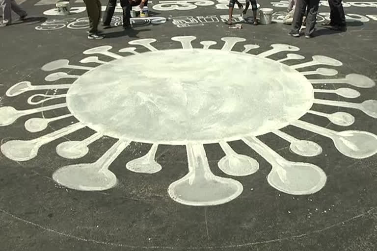 awareness on corona with paintings on roads in vijayawada