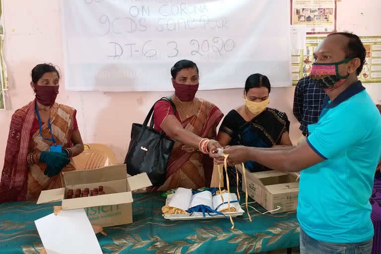 mask and sanitizer distributed in sonepur