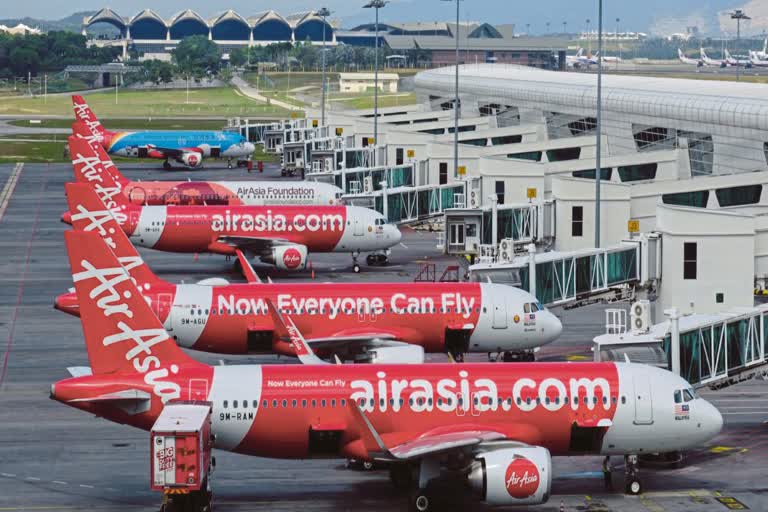 airasia cuts staff salaries by up to 20 percent for april