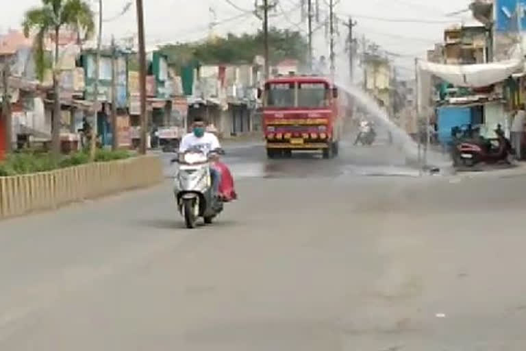 Road and shops are being sanitized before the market opens in Damoh