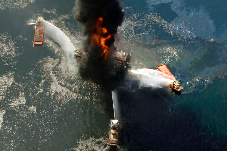 This April 21, 2010 file photo shows the Deepwater Horizon oil rig burning after an explosion in the Gulf of Mexico, off the southeast tip of Louisiana.