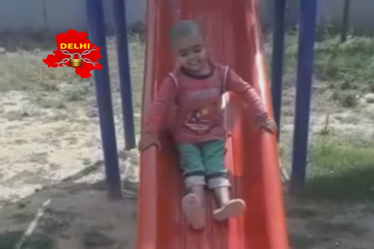 Swing on the faces of children by swinging in delhi in during the lockdown