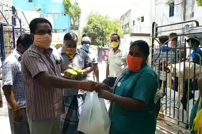 Distribution of essential commodities for sanitation workers at naidupeta in nellore