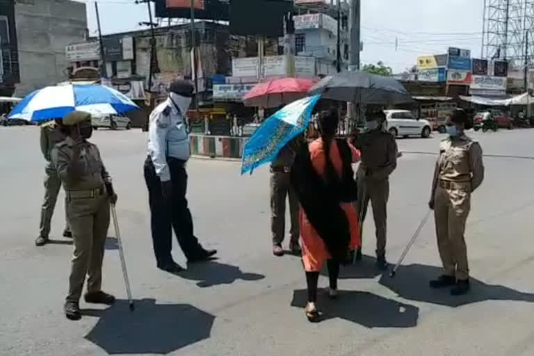 umbrellas to women policemen.