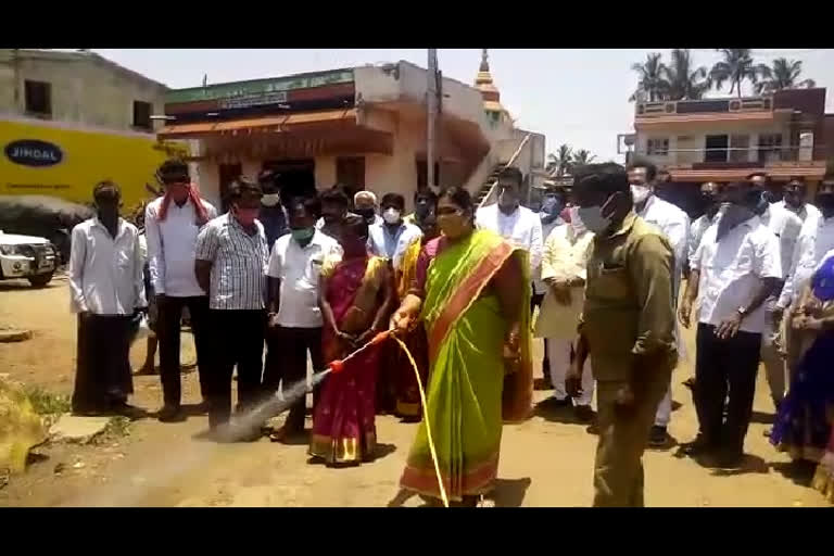 mla Shivalli drives  spray in Varur village