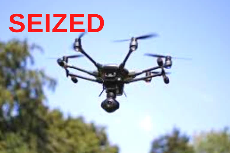 Drone hovering over security