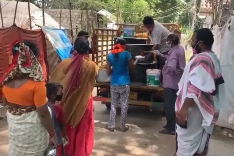 Distributing food to the poor under the Gnanayagam Trust in tenali