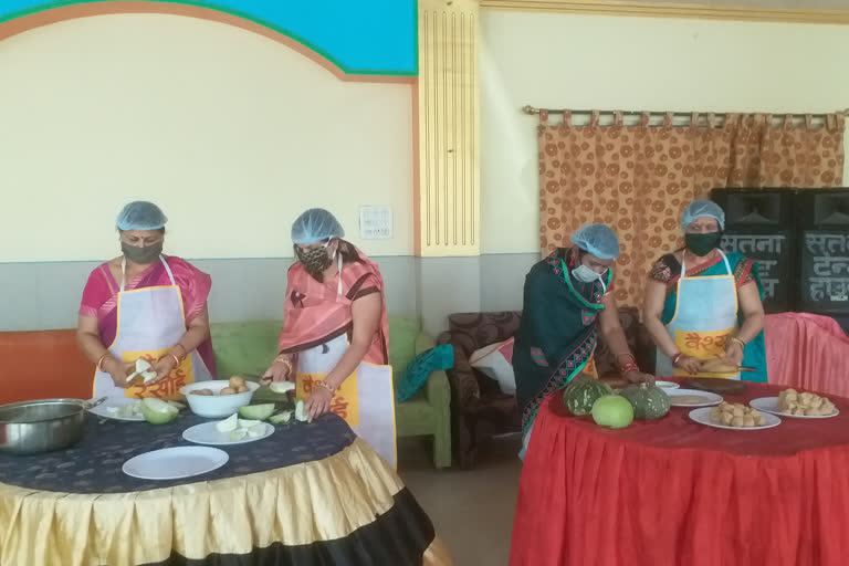 Women making food in the kitchen of Vaishya society