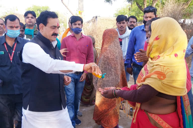 Home and Health Minister Dr. Narottam Mishra distributed material to the poor