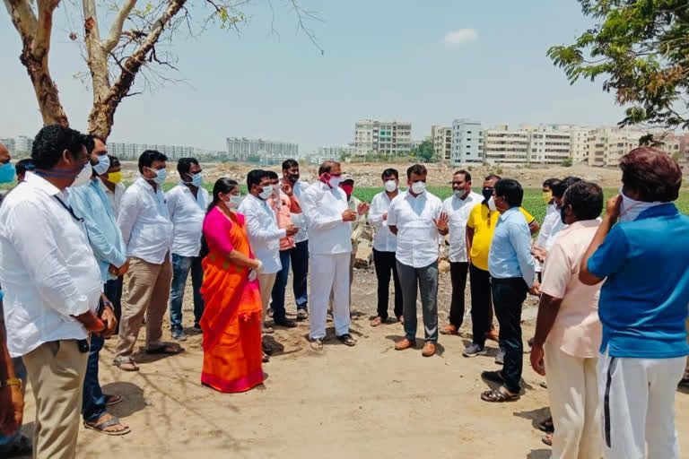 MLAs examining Ambir Lake in hyderabad