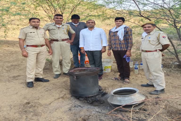 jalore news  raniwada news  seizure of alcohol  handcuffs confiscated alcohol  wine in tawidar village