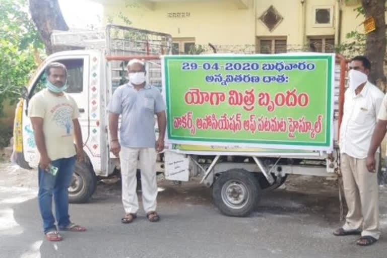 Distributing food to the poor in Vijayawada