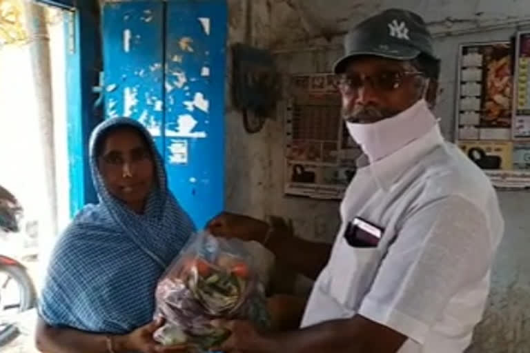 elecrical department line inspector distributing vegetables to poor in yerragondapalem