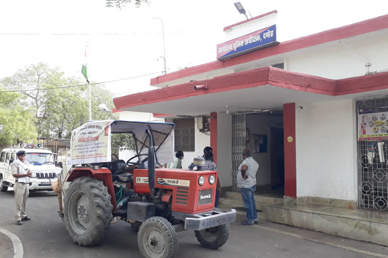 Members of Kurmi Kshatriya organization spraying sanitizer