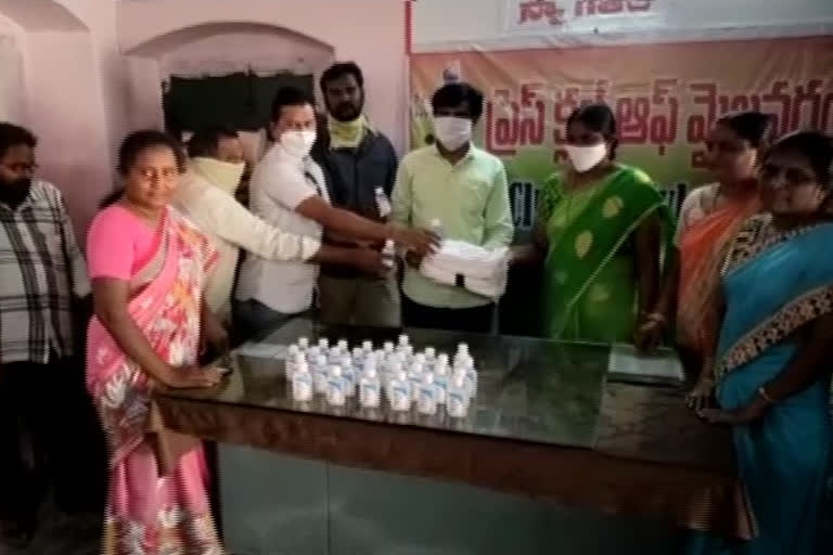 Distribution of masks and sanitizers during Mayday at mailavaram in krishna