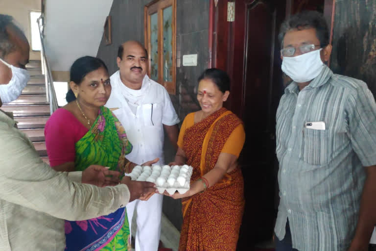 tdp leader distributing eggs to their 6th ward in mandapeta