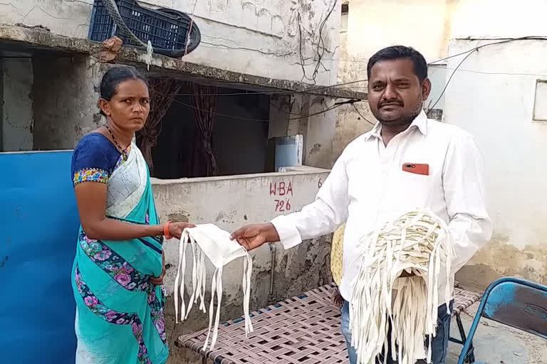 masks distributing by gram ward volunteers in yerragondapalem