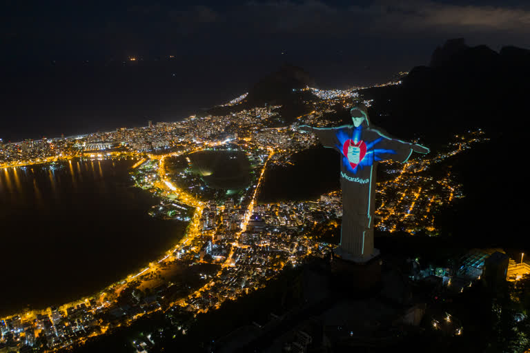 Watch: Rio's Christ statue lit up with mask on to raise awareness