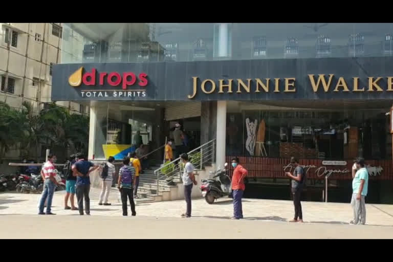 People standing in line for liquor purchase