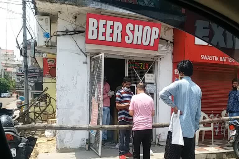 long queue outside liquor shops